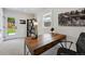 Office with a wooden desk, shelving unit, and a door leading to the backyard at 3275 19Th St, Boulder, CO 80304
