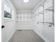 Well-organized walk-in closet featuring an array of shelving and storage options plus a window for natural light at 3275 19Th St, Boulder, CO 80304