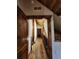 Long hallway featuring wood accents throughout, neutral walls, and wood-style flooring at 733 Rainbow Rd, Idaho Springs, CO 80452