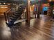Unique log staircase with wood banisters, wood treads, and natural light at 733 Rainbow Rd, Idaho Springs, CO 80452