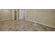 This is an empty finished basement area with neutral colored walls and tile flooring at 1552 Hudson St, Denver, CO 80220