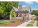 Brick home with landscaped front yard, pergola detail, a classic chimney, and inviting curb appeal at 1552 Hudson St, Denver, CO 80220