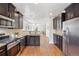 Modern kitchen featuring stainless steel appliances, granite countertops, and an open layout at 1552 Hudson St, Denver, CO 80220