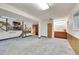 Finished basement with stairs to kitchen area and access to storage area at 8487 Yarrow Ct, Arvada, CO 80005