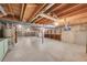 Large unfinished basement with exposed beams and a concrete floor offers lots of storage at 8487 Yarrow Ct, Arvada, CO 80005