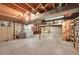 Unfinished basement with exposed ceiling, laundry, shelving, and workspace potential at 8487 Yarrow Ct, Arvada, CO 80005