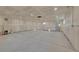 Unfinished basement with concrete floors, recessed lighting, perfect for customization and storage at 8487 Yarrow Ct, Arvada, CO 80005