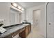 Bathroom with large vanity, sink, and a large mirror at 8487 Yarrow Ct, Arvada, CO 80005