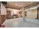 Spacious garage with concrete floor, ample lighting, and workspace potential at 8487 Yarrow Ct, Arvada, CO 80005