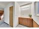 Hallway with cabinet and storage leading to the main part of the basement at 8487 Yarrow Ct, Arvada, CO 80005