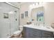 Modern bathroom with glass shower, sleek vanity, and contemporary finishes at 13 Buell Mansion Pkwy, Englewood, CO 80113