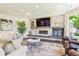 Cozy living room with fireplace, TV, and plush seating at 13 Buell Mansion Pkwy, Englewood, CO 80113