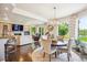 Cozy living area with fireplace and view of backyard pond at 13 Buell Mansion Pkwy, Englewood, CO 80113