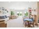 Bright living room featuring lake views, neutral decor, and ample natural light at 13 Buell Mansion Pkwy, Englewood, CO 80113