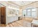 Luxurious main bathroom featuring a soaking tub and dual vanities at 13 Buell Mansion Pkwy, Englewood, CO 80113