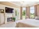 Bright and airy main bedroom with fireplace and scenic views at 13 Buell Mansion Pkwy, Englewood, CO 80113