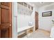 Mudroom with built-in bench, hooks, and storage baskets for organization at 13 Buell Mansion Pkwy, Englewood, CO 80113