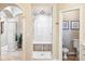 Walk-in shower with glass enclosure and a built-in bench at 13 Buell Mansion Pkwy, Englewood, CO 80113