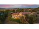 Expansive estate aerial view featuring lush landscaping, mature trees, and a sprawling lawn at 11541 Warrington Ct, Parker, CO 80138