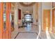 Grand foyer featuring soaring ceilings, marble flooring, and a stunning chandelier at 11541 Warrington Ct, Parker, CO 80138