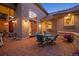 Charming outdoor patio area with comfortable seating and elegant lighting at 11541 Warrington Ct, Parker, CO 80138