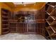 Stunning wine cellar with custom racks, ample storage, and elegant lighting for the wine enthusiast at 11541 Warrington Ct, Parker, CO 80138