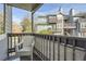 Relaxing balcony features an outdoor chair with views of the neighborhood and surrounding buildings at 7895 Allison Way # 203, Arvada, CO 80005