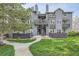 Attractive multi-level condominium with lawn, mature trees, and wood-look fencing at 7895 Allison Way # 203, Arvada, CO 80005