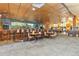 Stylish bar area with ample seating, a well-stocked bar, and cozy tables, perfect for socializing at 3022 S Wheeling Way # 109, Aurora, CO 80014