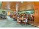 Cozy bar and lounge area with wood accents, comfortable seating, and a well-stocked bar at 3022 S Wheeling Way # 109, Aurora, CO 80014
