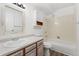 Cozy bathroom featuring a tub and shower combination with ample counter space and storage at 3022 S Wheeling Way # 109, Aurora, CO 80014