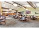 Expansive dining area featuring multiple tables, chairs, and large windows, creating an inviting atmosphere at 3022 S Wheeling Way # 109, Aurora, CO 80014