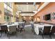 Elegant dining room featuring large windows, neutral decor, and neatly arranged tables at 3022 S Wheeling Way # 109, Aurora, CO 80014
