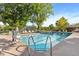 Outdoor community pool with chairs available to sit and relax by the poolside at 3022 S Wheeling Way # 109, Aurora, CO 80014