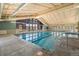 Indoor pool features a lap lane, vaulted ceilings, large windows, and inviting atmosphere at 3022 S Wheeling Way # 109, Aurora, CO 80014