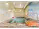 Indoor spa area features a tiled hot tub, signage, and well-maintained facilities at 3022 S Wheeling Way # 109, Aurora, CO 80014