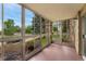 Enclosed sunroom with views of a green space and clear blue skies at 3022 S Wheeling Way # 109, Aurora, CO 80014