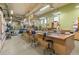 Spacious workshop with ample lighting, worktables, storage cabinets, and various tools at 3022 S Wheeling Way # 109, Aurora, CO 80014