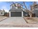 Charming two-story home with attached two-car garage and well-maintained lawn at 9561 Brentford Dr, Highlands Ranch, CO 80130