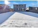Large backyard covered in snow, offering privacy and space at 25643 E Bayaud Ave, Aurora, CO 80018