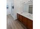 Main bathroom with double vanity and a walk-in shower at 25643 E Bayaud Ave, Aurora, CO 80018