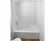 Clean bathtub with white tile surround at 25643 E Bayaud Ave, Aurora, CO 80018