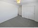 Bedroom with double door closet and grey carpet at 25643 E Bayaud Ave, Aurora, CO 80018