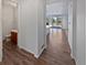 Hallway with wood-look floors and views into other rooms at 25643 E Bayaud Ave, Aurora, CO 80018