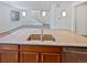 Kitchen island with double sink and granite countertop at 25643 E Bayaud Ave, Aurora, CO 80018