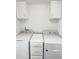 Laundry room with washer and dryer and white cabinets at 25643 E Bayaud Ave, Aurora, CO 80018