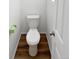 Clean toilet in a small bathroom with wood-look flooring at 25643 E Bayaud Ave, Aurora, CO 80018