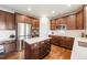 Gourmet kitchen with stainless steel appliances and an island at 673 Tiger Lily Way, Highlands Ranch, CO 80126