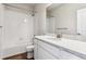 Bathroom with a white vanity and countertop, a bathtub, and a modern toilet on a wood floor at 2536 Wesley Ln, Lafayette, CO 80026