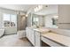 A bathroom with a glass door walk-in shower and large mirror with a white sink at 2536 Wesley Ln, Lafayette, CO 80026